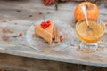 Halloween inspiration. cake n wood table. Autumn still life. pumpkin, dry roses, viburnum honey . in a vase. twigs. on