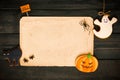 Halloween invitation over wooden background