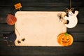 Halloween invitation over wooden background