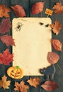 Halloween invitation over wooden background