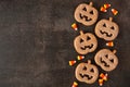Halloween Jack O Lantern cookie side border on a dark background Royalty Free Stock Photo