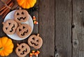 Halloween Jack o Lantern cookie side border with decor on a dark wood background Royalty Free Stock Photo