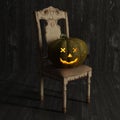 Halloween Jack-O-Lantern Pumpkin on a chair.