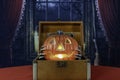 Halloween jack-o-lantern in vintage suitcase with skeleton hands