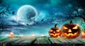 Halloween - Jack O` Lanterns And Candles On Table Royalty Free Stock Photo