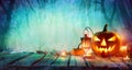 Halloween - Jack O` Lanterns And Candles On Table Royalty Free Stock Photo