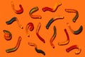 Halloween jelly beans worms orange background