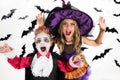 Halloween kids, Happy scary girl and boy dressed up in halloween costumes of witch, sorcerer and vampire Dracula for pumpkin patch Royalty Free Stock Photo