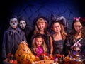 Halloween kids holding carved pumpkin .