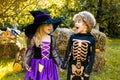 Halloween kids holidays concept. Halloween party with children wearing Halloween costumes. Happy children with skeleton