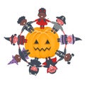 Halloween kids party template. Children in Halloween costumes around halloween pumpkin. Multicultural group of children Royalty Free Stock Photo