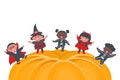 Halloween kids party template. Children in Halloween costumes dance on holiday pumpkin. Diverse group of kids have fun