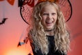 Halloween kids Portrait laughing girl in witch costume hat at home. Ready for trick or treat holiday. Royalty Free Stock Photo