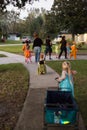 Halloween and kids trick or treating going door to door