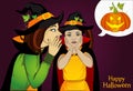 Halloween. The little girl`s mother whispers a secret in her ear