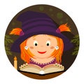 Halloween. Little whitch-girl reading a spellbook