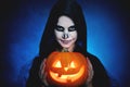 Halloween. magic skeleton with pumpkin. woman in makeup and co Royalty Free Stock Photo