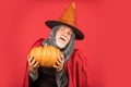 Halloween man with pumpkin. Halloween party. witch man in hat and cloak. happy halloween. Weird old grandfather with
