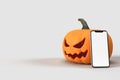 Halloween mock-up pumpkins with smartphone. Halloween concept mockup. 3D rendering