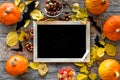 Halloween mockup. Chalkboard near paper bats and pumpkins on wooden background top view