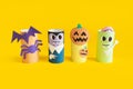 Halloween monster toy from toilet paper tube. Pumpkin jack, zombie, vampire, bat, spider on yellow or orange background