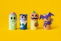 Halloween monster toy from toilet paper tube. Pumpkin jack, zombie, vampire, bat, spider on yellow or orange background