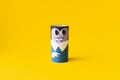 Halloween monster toy from toilet paper tube. Vampire on yellow or orange background. Easy DIY craft idea for kids. Eco