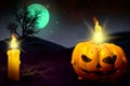 Halloween multi colored scary dark mockup - lone candle on left and candle in pumpkin style on right side, jack-o-lantern concept