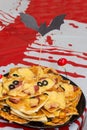 Halloween mummies mini pizzas with ketchup, cheese and black olives on plate Royalty Free Stock Photo