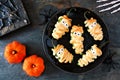 Halloween mummy jalapeno poppers, scene on dark stone Royalty Free Stock Photo