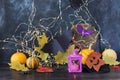 Halloween mystical decor, lantern with burning candle, autumn leaves on a black background, decorated home interior for the holida Royalty Free Stock Photo