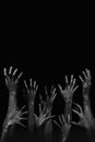 Halloween night background of numerous scary and creepy zombie hands rising from dark shadows, creating a spooky atmosphere ideal Royalty Free Stock Photo