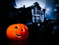 Halloween night background with scary house and bat and pumpkin Royalty Free Stock Photo