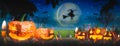 Halloween night horrifying pumpkins,tombstones and cemetery spooky scary,ghost and witch flying in air,moon and sky background ,ba Royalty Free Stock Photo