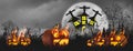 Halloween night with horrifying pumpkins,tombstones and cemetery spooky scary,moon and sky background with castle,banner header Royalty Free Stock Photo