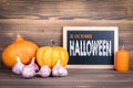 Halloween 31 October, pumpkins, candle and garlic