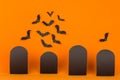 Halloween orange background with blank black sale labels and bats flock, mock up.