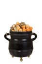 Halloween orange and black licorice popcorn in old black cauldron Royalty Free Stock Photo