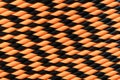 Halloween orange and black striped drinking straws as background. Top view. Pattern Royalty Free Stock Photo