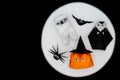 The Halloween origami or Paper folding of pumpkin head jack-o-lantern, mummy, nun, spider and bat on white and black background Royalty Free Stock Photo
