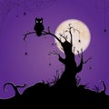 halloween owl sitting on dead tree