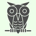 Halloween owl solid icon. Single spooky owl sitting on a tree branch glyph style pictogram on white background