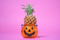 Festive treat for halloween pineapple in candlestick. Sweetness or nasty Royalty Free Stock Photo