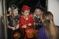 Halloween Party With Children Trick Or Treating In Costume Royalty Free Stock Photo