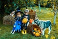 Halloween party with children wearing Halloween costumes. Happy Halloween with sweets candles. Two kids like skeleton or