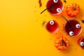 Halloween party concept. Top view photo of floating eyes punch in glasses pumpkins centipedes cockroach spiders and confetti on Royalty Free Stock Photo