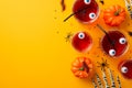 Halloween party concept. Top view photo of floating eyes punch in glasses pumpkins skeleton hands centipedes cockroach spiders and Royalty Free Stock Photo