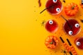 Halloween party concept. Top view photo of glasses with drink floating eyes punch straws pumpkins insects centipedes cockroach Royalty Free Stock Photo