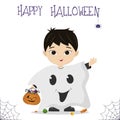 Halloween party. A cute Asian boy in a ghost costume is holding a pumpkin with sweets, a spider and a cobweb. Postcard Royalty Free Stock Photo