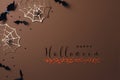 Halloween party decorations from bats, spider web and confetti. Minimal holiday greeting card with text happy halloween